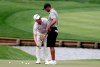 Tiger Woods, right, talks with Matt Killen, the putting coach of Justin Thomas, who is working with Woods the week, during a practice round of The Players Championship golf tournament, Wednesday, March 13, 2019, in Ponte Vedra Beach, Fla. (AP Photo/Lynne Sladky)