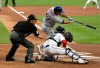 New York Mets' Wilson Ramos (40) hits an RBI-single to score Brandon Nimmo during the first inning of a baseball game, Tuesday, April 2, 2019, in Miami. At right is Miami Marlins catcher Jorge Alfaro. (AP Photo/Lynne Sladky)