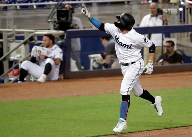 Miami Marlins' Miguel Rojas reacts after hitting a solo home run during the second inning of a baseball game against the Arizona Diamondbacks, Monday, July 29, 2019, in Miami. (AP Photo/Lynne Sladky)