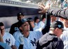 New York Yankees' Troy Tulowitzki celebrates in the dugout after hitting a solo home run in the first inning during a spring training baseball game against the Toronto Blue Jays, Monday, Feb. 25, 2019, in Tampa, Fla. (AP Photo/Lynne Sladky)