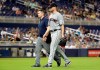 Cleveland Indians starting pitcher Corey Kluber, right, leaves during the fifth inning of the team's baseball game against the Miami Marlins, Wednesday, May 1, 2019, in Miami. Kluber was hit by a single hit by Marlins' Brian Anderson. (AP Photo/Lynne Sladky)