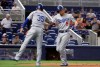 Los Angeles Dodgers' Corey Seager (5) is met by Cody Bellinger (35) after hitting a two-run home run during the first inning of the team's baseball game against the Miami Marlins, Wednesday, Aug. 14, 2019, in Miami. (AP Photo/Lynne Sladky)