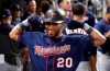 Minnesota Twins' Eddie Rosario (20) celebrates in the dugout after hitting a two-run home run during the fifth inning of the team's baseball game against the Miami Marlins, Wednesday, July 31, 2019, in Miami. (AP Photo/Lynne Sladky)
