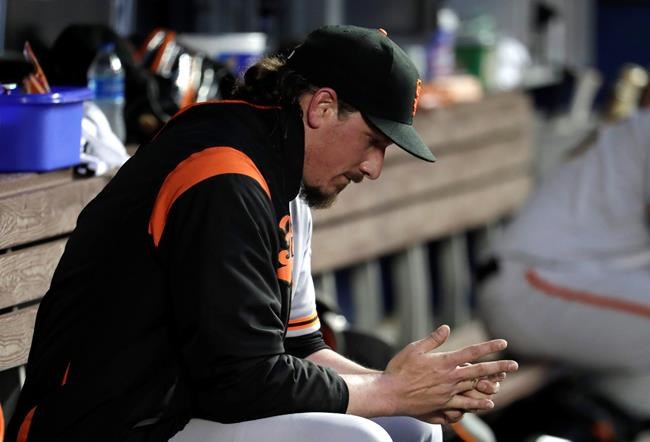 San Francisco Giants starting pitcher Jeff Samardzija sits in the dugout during the fourth inning of a baseball game against the Miami Marlins, Tuesday, May 28, 2019, in Miami. (AP Photo/Lynne Sladky)