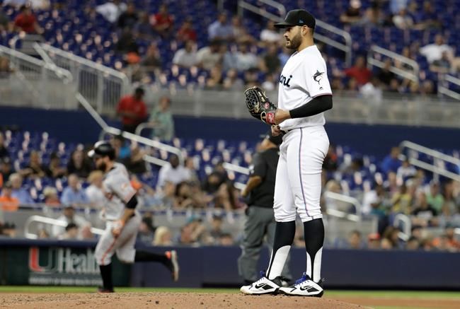 Miami Marlins starting pitcher Pablo Lopez stands on the mound as San Francisco Giants' Brandon Belt rounds the bases on a solo home run during the fourth inning of a baseball game Wednesday, May 29, 2019, in Miami. (AP Photo/Lynne Sladky)