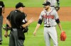 Home plate umpire Jeff Nelson, left, talks with Atlanta Braves starting pitcher Kevin Gausman after Gausman was ejected for throwing at Miami Marlins' Jose Urena during the second inning of a baseball game Friday, May 3, 2019, in Miami. (AP Photo/Lynne Sladky)