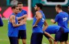 Barcelona's Philippe Coutinho, left, talks with Luis Suarez, center, during soccer practice Tuesday, Aug. 6, 2019, in Miami Gardens, Fla. FC Barcelona plays SSC Napoli on Wednesday. (AP Photo/Lynne Sladky)
