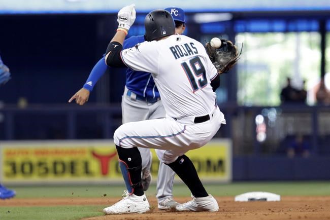 Miami Marlins' Miguel Rojas (19) is tagged out by Kansas City Royals second baseman Nicky Lopez during the fourth inning of a baseball game Sunday, Sept. 8, 2019, in Miami. (AP Photo/Lynne Sladky)