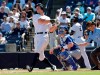 New York Yankees' Aaron Judge, left, follows through on a double in the third inning during a spring training baseball game against the Toronto Blue Jays, Monday, Feb. 25, 2019, in Tampa, Fla. At right is Toronto Blue Jays catcher Danny Jansen. (AP Photo/Lynne Sladky)