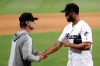 Miami Marlins manager Don Mattingly, left, shakes hands with starting pitcher Sandy Alcantara after a baseball game against the Kansas City Royals, Sunday, Sept. 8, 2019, in Miami. Alcantara pitched a complete game as the Marlins won 9-0. (AP Photo/Lynne Sladky)wbb
