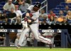 Atlanta Braves' Brian McCann hits a two-run home run during the sixth inning of the team's baseball game against the Miami Marlins, Friday, May 3, 2019, in Miami. (AP Photo/Lynne Sladky)