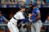 Tampa Bay Rays catcher Travis d'Arnaud, left, celebrates a strike out of Texas Rangers' Delino DeShields, right, during the sixth inning of a baseball game Saturday, June 29, 2019, in St. Petersburg, Fla. (AP Photo/Mike Carlson)