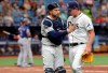 Tampa Bay Rays catcher Travis d'Arnaud congratulates starting pitcher Brendan McKay after striking out Texas Rangers' Delino DeShields during the sixth inning of a baseball game Saturday, June 29, 2019, in St. Petersburg, Fla. (AP Photo/Mike Carlson)
