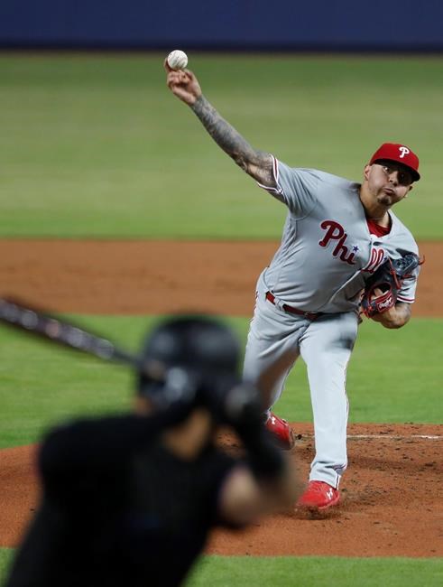 Philadelphia Phillies' Vince Velasquez, top, pitches to Miami Marlins' Harold Ramirez during the first inning of a baseball game, Friday, June 28, 2019, in Miami. (AP Photo/Wilfredo Lee)