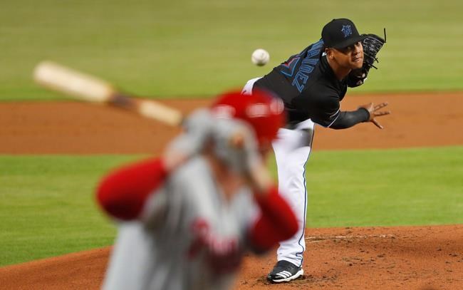 Miami Marlins' Elieser Hernandez, top, pitches to Philadelphia Phillies' Rhys Hoskins during the first inning of a baseball game, Friday, June 28, 2019, in Miami. (AP Photo/Wilfredo Lee)