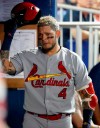 St. Louis Cardinals' Yadier Molina takes off his helmet after striking out during second the inning of the team's baseball game against the Miami Marlins, Tuesday, June 11, 2019, in Miami. (AP Photo/Wilfredo Lee)