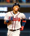 Atlanta Braves' Ronald Acuna Jr. blows a bubble as he rounds second base after hitting a home run during the fourth inning of a baseball game against the Miami Marlins, Friday, June 7, 2019, in Miami. (AP Photo/Wilfredo Lee)