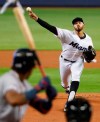 Miami Marlins' Pablo Lopez pitches to Atlanta Braves' Ronald Acuna Jr. during the first inning of a baseball game, Sunday, June 9, 2019, in Miami. (AP Photo/Wilfredo Lee)