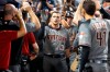 Arizona Diamondbacks' Nick Ahmed (13) is congratulated by teammates after he hit a grand slam home run scoring Eduardo Escobar, Christian Walker and Jake Lamb during the fourth inning of a baseball game against the Miami Marlins, Saturday, July 27, 2019, in Miami. (AP Photo/Wilfredo Lee)