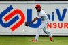 Cincinnati Reds right fielder Aristides Aquino bobbles a ball hit by Miami Marlins' Jorge Alfaro for a single during the fourth inning of a baseball game Thursday, Aug. 29, 2019, in Miami. (AP Photo/Wilfredo Lee)