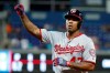 Washington Nationals' Howie Kendrick celebrates a base hit during the sixth inning of a baseball game against the Miami Marlins, Friday, Sept. 20, 2019, in Miami. (AP Photo/Wilfredo Lee)