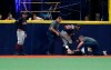 Cleveland Indians left fielder Tyler Naquin lies on the turf after making a catch against the Tampa Bay Rays during the fifth inning of a baseball game Friday, Aug. 30, 2019, in St. Petersburg, Fla. (AP Photo/Scott Audette)
