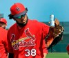 St. Louis Cardinals' Jose Martinez waves to fans as he arrives before the start of an exhibition spring training baseball game against the Miami Marlins Saturday, Feb. 23, 2019, in Jupiter, Fla. Martinez has signed a $3.25 million, two-year contract to remain with the St. Louis Cardinals. (AP Photo/Jeff Roberson)