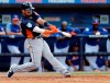 Houston Astros Robinson Chirinos hits an RBI single during the fifth inning of an exhibition spring training baseball game against the New York Mets, Saturday, March 2, 2019, in Port St. Lucie, Fla. (AP Photo/Jeff Roberson)