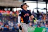 Houston Astros' Alex Bregman looks up as he walks to first after being hit by a pitch during the fifth inning of an exhibition spring training baseball game against the New York Mets Saturday, March 2, 2019, in Port St. Lucie, Fla. (AP Photo/Jeff Roberson)