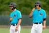 Miami Marlins minor league players Will Banfield, left, and Connor Scott take part in base running drills during spring training baseball practice Tuesday, Feb. 26, 2019, in Jupiter, Fla. Banfield and Scott, both native English speakers, are taking part in a program offered by the team to teach players and coaches Spanish. (AP Photo/Jeff Roberson)