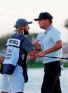 Keith Mitchell, right, celebrates with his caddie Pete Persolija after finishing the 18th hole to win the final round of the Honda Classic golf tournament, Sunday, March 3, 2019, in Palm Beach Gardens, Fla. (AP Photo/Wilfredo Lee)