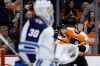 (AP Photo/Matt Slocum)
Philadelphia Flyers' Phil Varone, centre, celebrates with Mikhail Vorobyev, right, after scoring a goal on Winnipeg Jets' Laurent Brossoit during the second period Monday in Philadelphia.