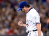 Toronto Blue Jays pitcher Jason Grilli reacts as he walks off the field after the seventh inning MLB baseball action against the New York Yankees in Toronto, Wednesday, June 1, 2016. THE CANADIAN PRESS/Frank Gunn