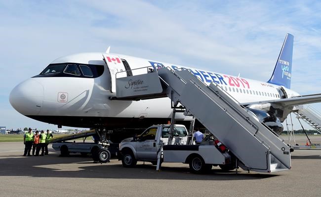 Conservative Leader Andrew Scheer's campaign plane sits on the tarmac after being towed to the gate after experiencing a ground steering issue, in Calgary on Monday, Sept. 16, 2019. THE CANADIAN PRESS/Frank Gunn