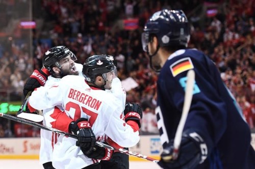 Team Canada's Patrice Bergeron (37) celebrates his goal against Team Europe with teammates Brent Burns (88) and Steven Stamkos (91) as Europe's Tobias Rieder (8) looks on during third period World Cup of Hockey finals action in Toronto on Thursday, September 29, 2016. THE CANADIAN PRESS/Frank Gunn