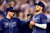 Tampa Bay Rays' Daniel Robertson, left, and Kevin Kiermaier celebrate as they cross the plate during eighth inning MLB baseball action against the Toronto Blue Jays in Toronto on Sunday, April 14, 2019. THE CANADIAN PRESS/Frank Gunn