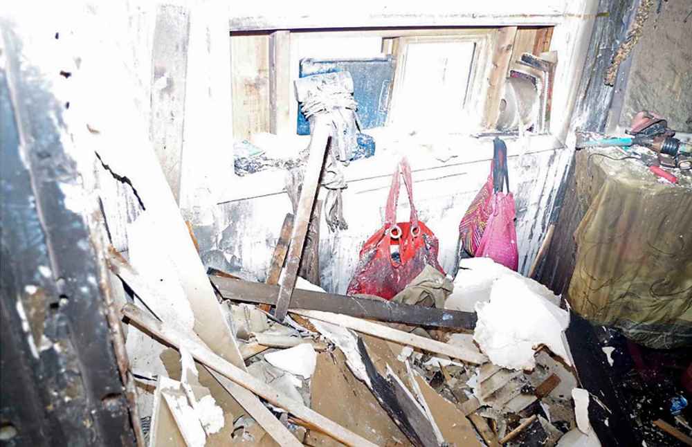 A photo from the trial shows Jeanenne Fontaine's purses hanging on the wall in the bedroom of her Aberdeen Avenue home after the fire. (Winnipeg Free Press)