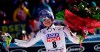 FILE - In this Sunday, Jan. 20, 2019 filer, United States' Lindsey Vonn holds a bunch of flowers after completing an alpine ski, women's World Cup super-G in Cortina D'Ampezzo, Italy. It seemed like destiny played a role on Sunday when Mikaela Shiffrin won what could very well turn out to be Lindsey Vonn's last race. Vonn broke down emotionally after she failed to finish a World Cup super-G on knees so worn down that she describes them as 