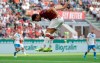 AC Milan's Hakan Calhanoglu scores his side's opening goal during the Serie A soccer match between AC Milan and Brescia, at the San Siro stadium in Milan, Italy, Saturday, Aug. 31, 2019. (AP Photo/Luca Bruno)