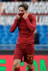 Roma midfielder Nicolo' Zaniolo kisses his jersey as he celebrates after scoring his side's opening goal during a Serie A soccer match between Roma and Torino, at the Rome Olympic Stadium, Saturday, Jan. 19, 2019. (AP Photo/Andrew Medichini)