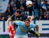Juventus' Andrea Barzagli, top, and Spal's Andrea Petagna vie for the ball during the Serie A soccer match between Spal and Juventus, at the Paolo Mazza stadium in Ferrara, Italy, Saturday, April 13, 2019. (AP Photo/Antonio Calanni)
