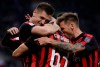 AC Milan's Krzysztof Piatek celebrates with teammates Patrick Cutrone and Lucas Biglia after scoring his side's opening goal during the Serie A soccer match between AC Milan and Udinese, at the San Siro stadium in Milan, Italy, Tuesday, April 2, 2019. (AP Photo/Luca Bruno)