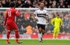 Fulham's Ryan Babel, right, runs next to Liverpool's Mohamed Salah after scoring his side's opening goal during the English Premier League soccer match between Fulham and Liverpool at Craven Cottage stadium in London, Sunday, March 17, 2019. (AP Photo/Kirsty Wigglesworth)