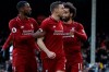 Liverpool's James Milner, center, celebrates after scoring his side's second goal, during the English Premier League soccer match between Fulham and Liverpool at Craven Cottage stadium in London, Sunday, March 17, 2019. (AP Photo/Kirsty Wigglesworth)
