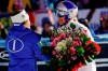 United States' Lindsey Vonn, right, receives a bunch of flowers from Italy's Sofia Goggia after completing an alpine ski, women's World Cup super-G in Cortina D'Ampezzo, Italy, Sunday, Jan. 20, 2019. (AP Photo/Giovanni Auletta)