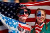 Brothers Austin, left, and Jordyn Chambers, from Philadelphia, hold up an US flag prior the Women's World Cup Group F soccer match between United States and Chile at Parc des Princes in Paris, France, Sunday, June 16, 2019. (AP Photo/Alessandra Tarantino)
