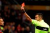 Referee Marco Di Bello, right, shows a red card to Bologna's Nicola Sansone, left, during the Italian Serie A soccer match between AC Milan and Bologna at the San Siro stadium, in Milan, Italy, Monday, May 6, 2019. Milan won 2-1. (AP Photo/Antonio Calanni)