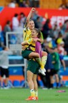 Australia's Chloe Logarzo, top, celebrates with a teammate at the end of the Women's World Cup Group C soccer match between Australia and Brazil at Stade de la Mosson in Montpellier, France, Thursday, June 13, 2019. Australia defeated Brazil 3-2. (AP Photo/Claude Paris)