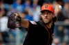 FILE - In this Feb. 24, 2019, file photo, San Francisco Giants starting pitcher Madison Bumgarner throws against the Chicago Cubs during the first inning of a spring baseball game in Scottsdale, Ariz. Bumgarner insists he is never one to live in the past, but always stays in the moment. So, the frustrations of his past two injury-shortened seasons are hardly on his mind. But the 2014 World Series MVP sure would like to return to the 200-inning pitcher he has long been when healthy. (AP Photo/Chris Carlson, File)