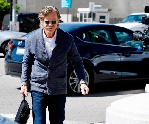 Actor William H. Macy arrives at the federal courthouse in Los Angeles, on Tuesday, March 12, 2019. Fifty people, including Macy's wife, actress Felicity Huffman and actress Lori Loughlin, were charged Tuesday in a scheme in which wealthy parents allegedly bribed college coaches and other insiders to get their children into some of the nation's most elite schools. Macy was not charged; authorities did not say why. (AP Photo/Alex Gallardo)